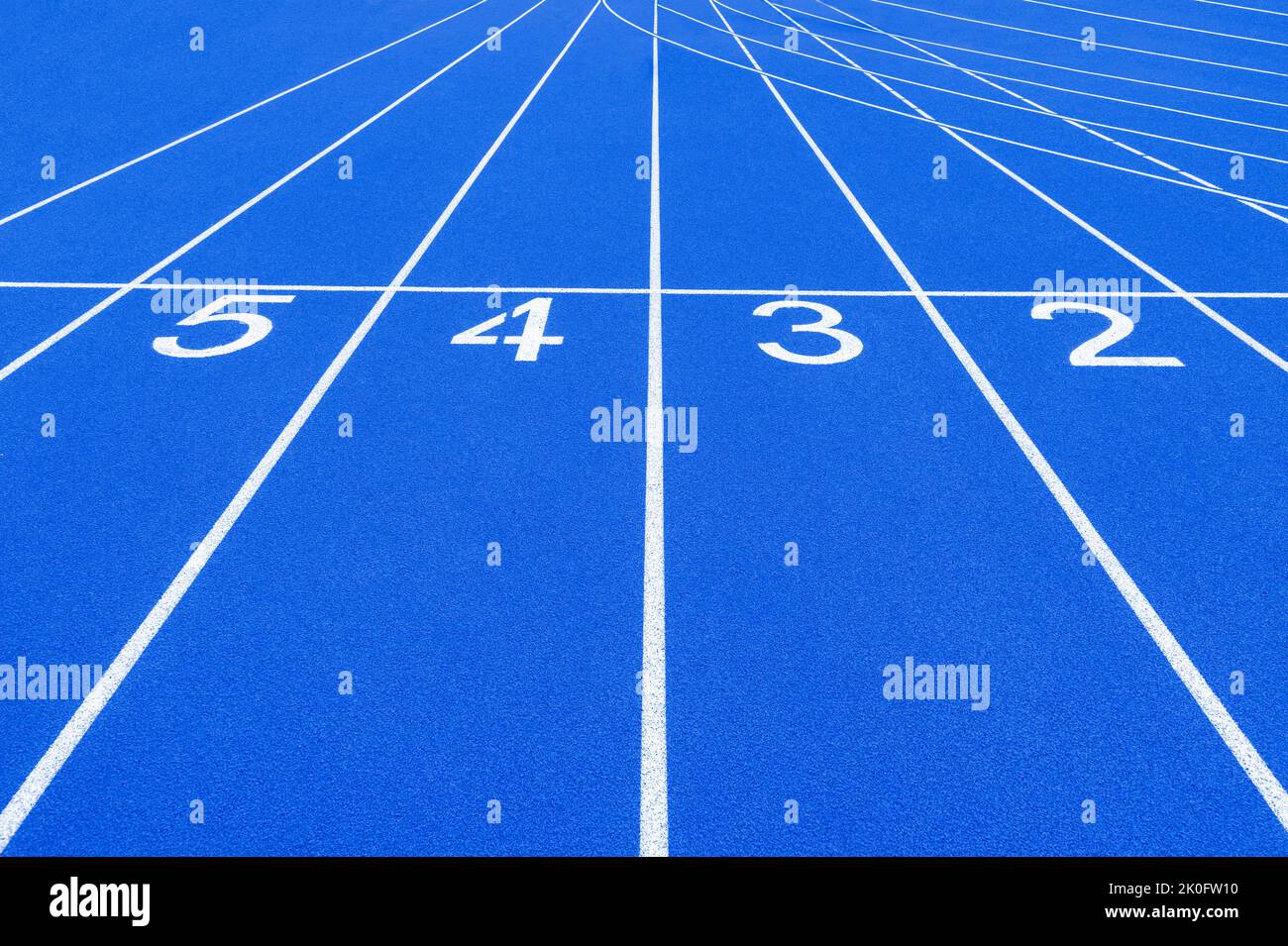 Blue track and field lanes and numbers. Running lanes at a track and ...
