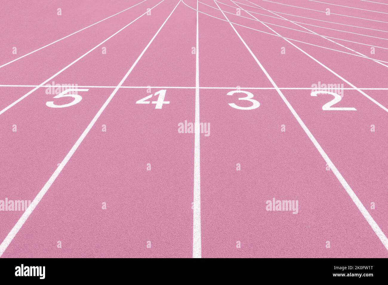 Pink track and field lanes and numbers. Running lanes at a track and field athletic center. Horizontal sport theme poster, greeting cards, headers, we Stock Photo