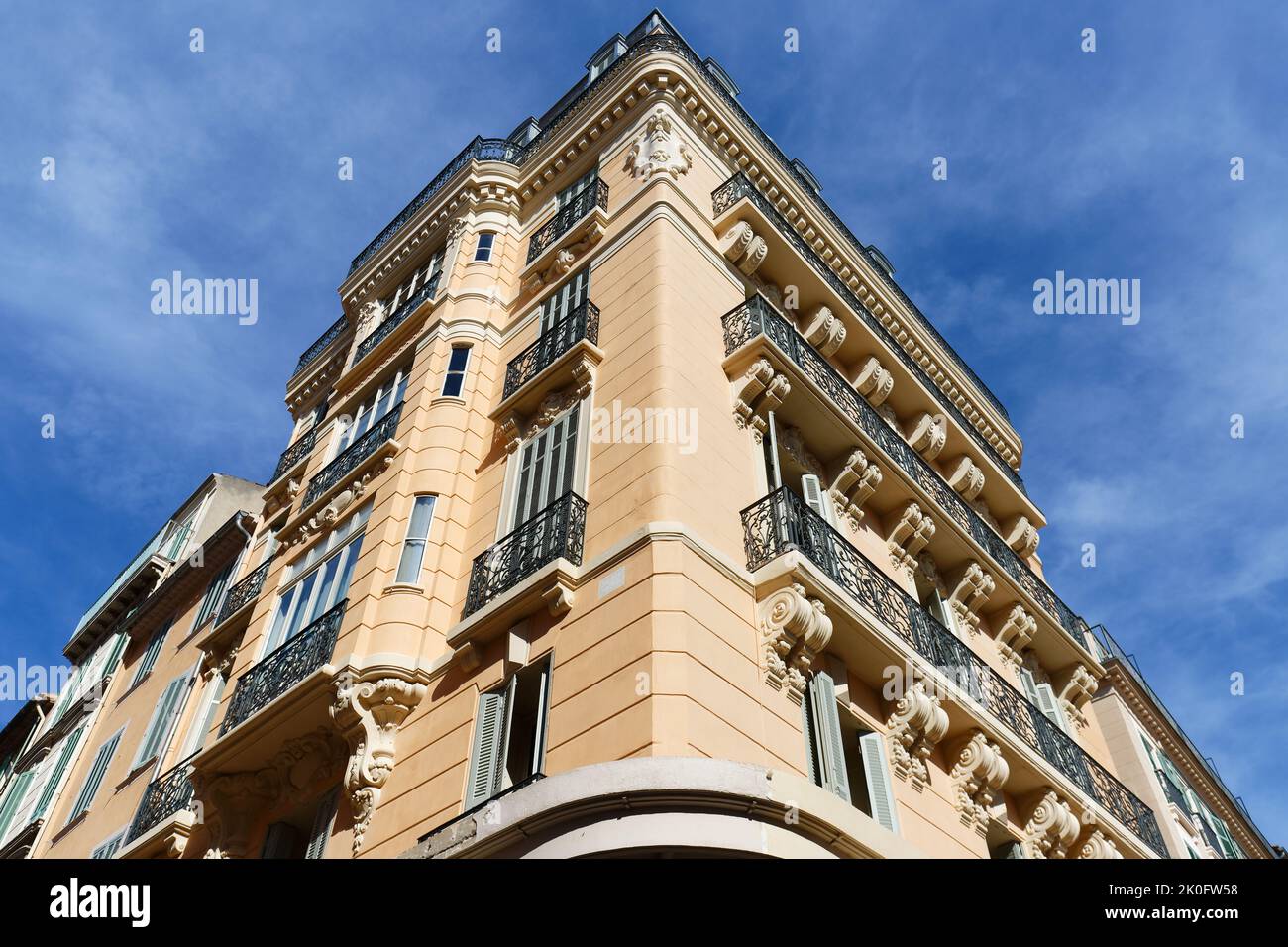 Looking up at the architectural details of an old apartment building in