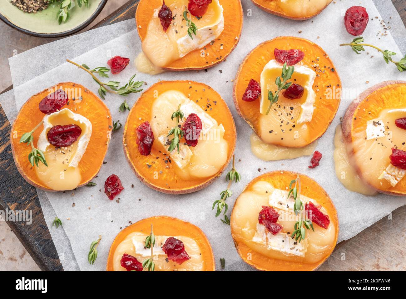 Baked Sweet Potato with brie cheese, cranberry and Walnut Stock Photo