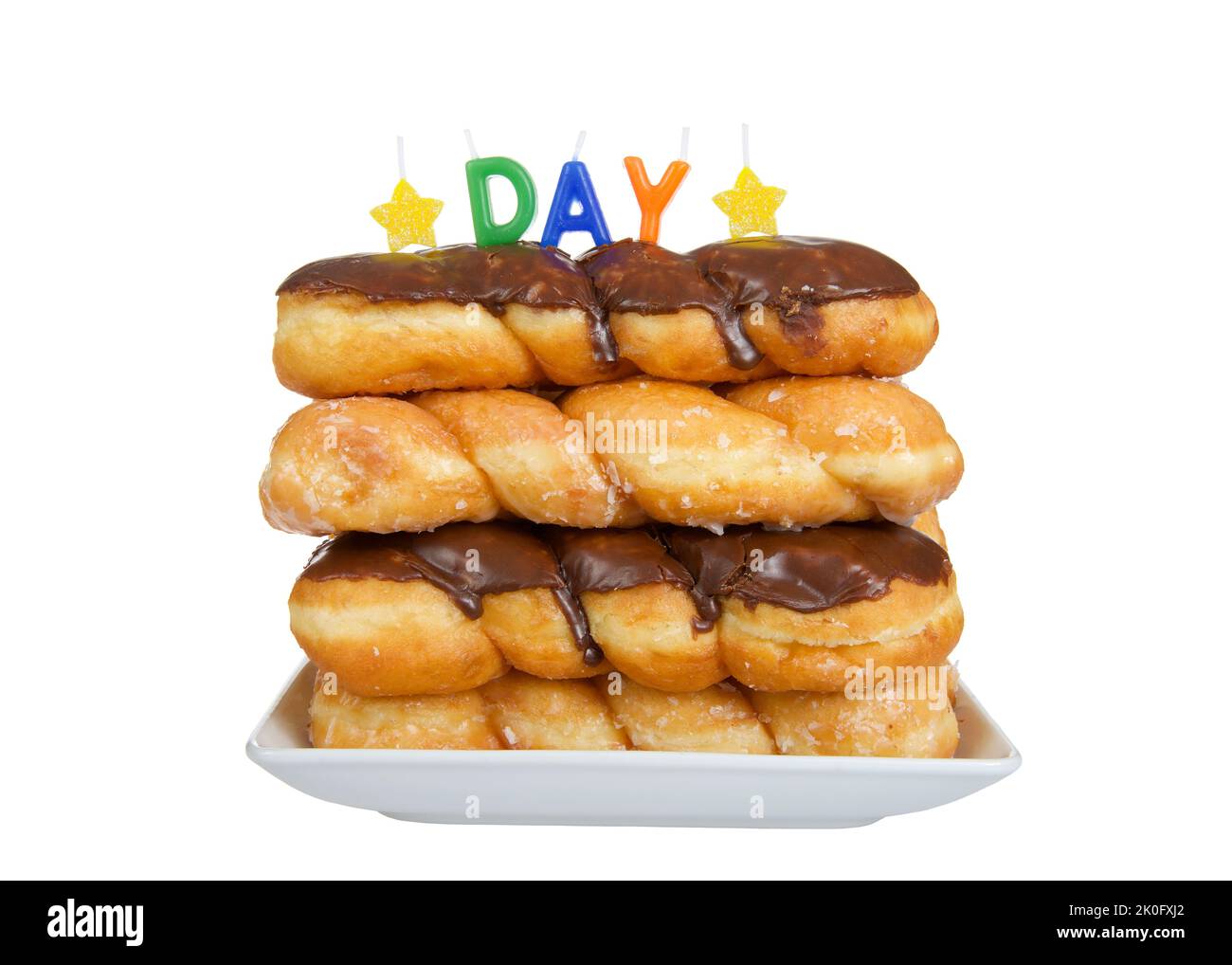 Porcelain plate with glazed and chocolate covered twist donuts stacked