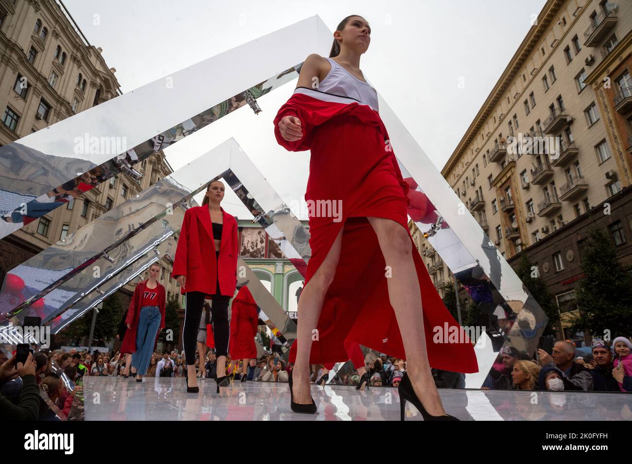 Moscow, Russia. 11th of September, 2022. Models are showing the collection 'Moscow 777' of the DNK Russia designer brand by Olga Kovalenko at a podium during celebrations marking the 875th birthday of Moscow in Tverskaya Street, Russia. Nikolay Vinokurov/Alamy Live News Stock Photo