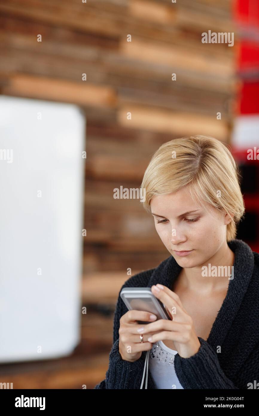 Replying to an important message. an attractive young designer in the ...