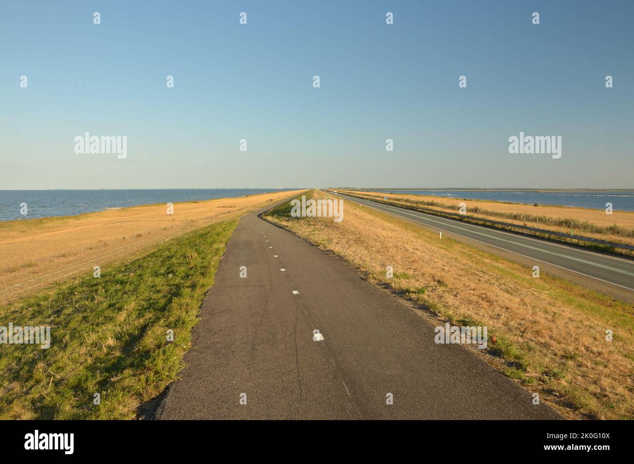 The cycle route along the 27km long Houtribdijk causeway in the Netherlands Stock Photo