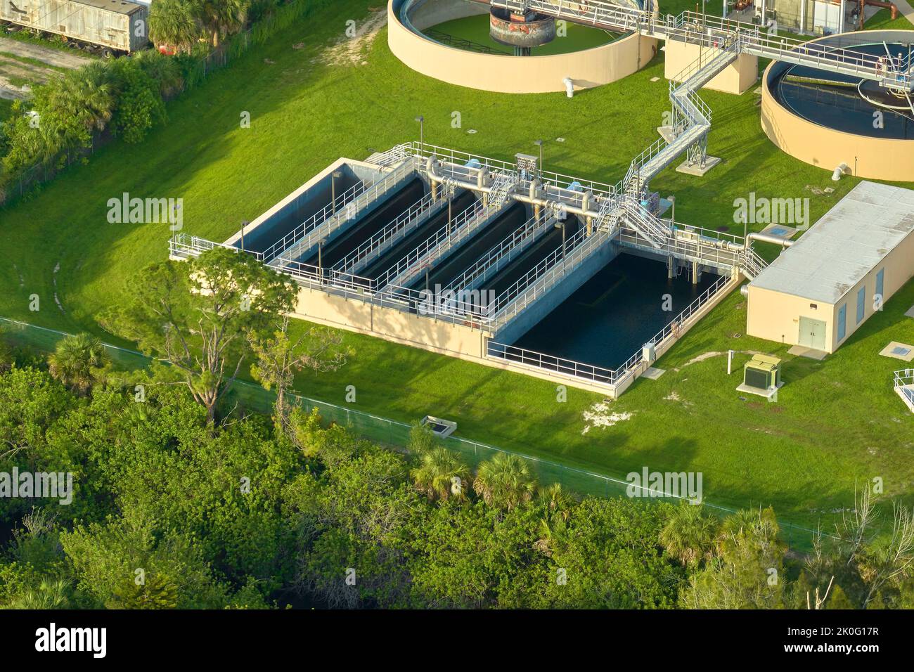 Aerial view of modern water cleaning facility at urban wastewater treatment plant. Purification