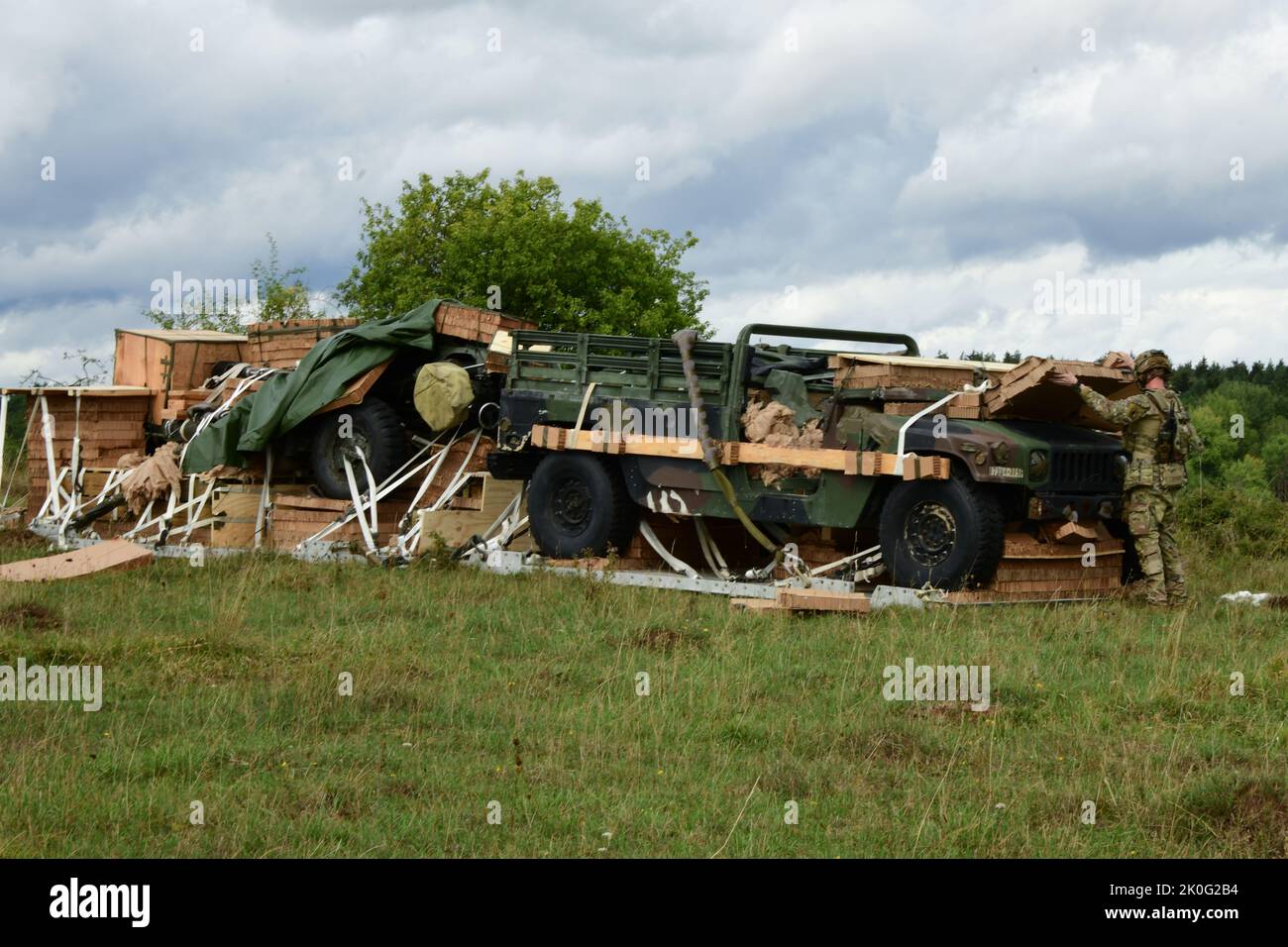 U.S. Army Specialist Jacob Luce, assigned to 173rd Infantry Brigade Combat Team- Airborne (173rd IBCT ABN) unpacks an M119 Howitzer during Exercise Saber Junction 22 at Hohenfels Training Area, Joint Multinational Readiness Center (JMRC) in Hohenfels, Germany, Sept. 8, 2022.    Saber Junction 22 is a combat training rotation designed to assess the readiness of the 173rd IBCT (ABN) in executing operations in a joint, combined environment and to promote interoperability with participating allied and partner nations. (U.S. Army photo by Spc. Ryan Parr) Stock Photo