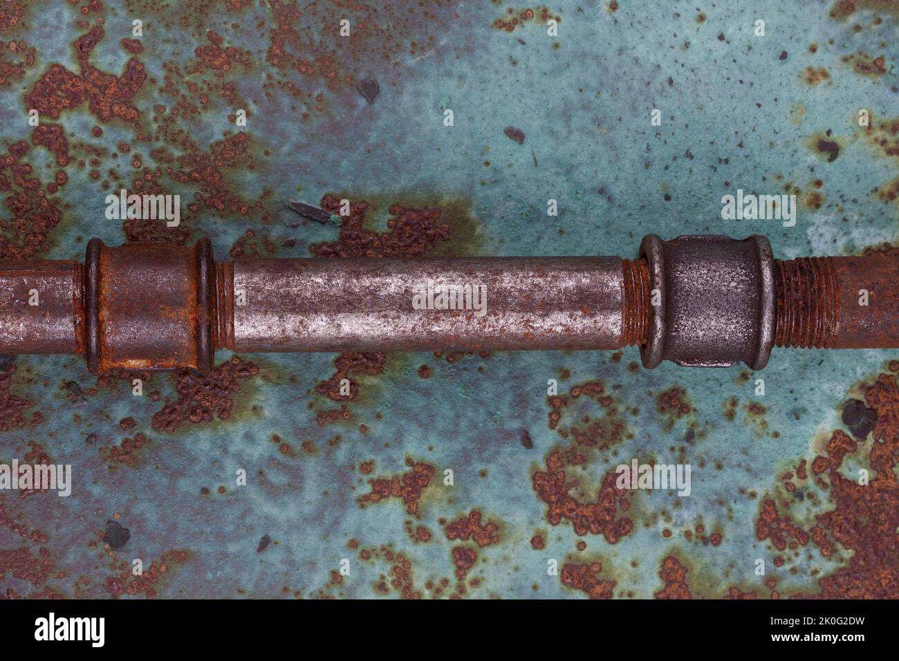 Old rusty valve pipes on rusty metal wall background Stock Photo - Alamy