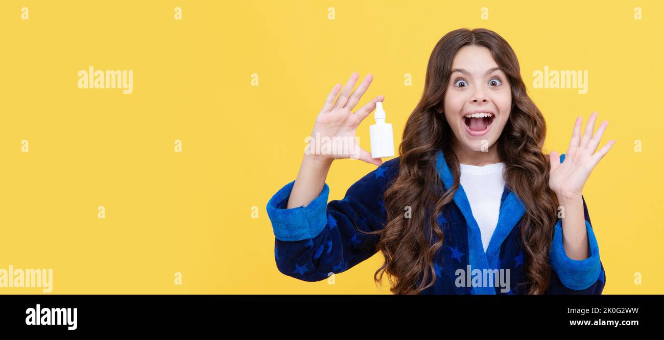 try this. best remedy against runny nose. free your stuffy nose. girl use nasal drops. Horizontal poster of isolated child face, banner header, copy Stock Photo