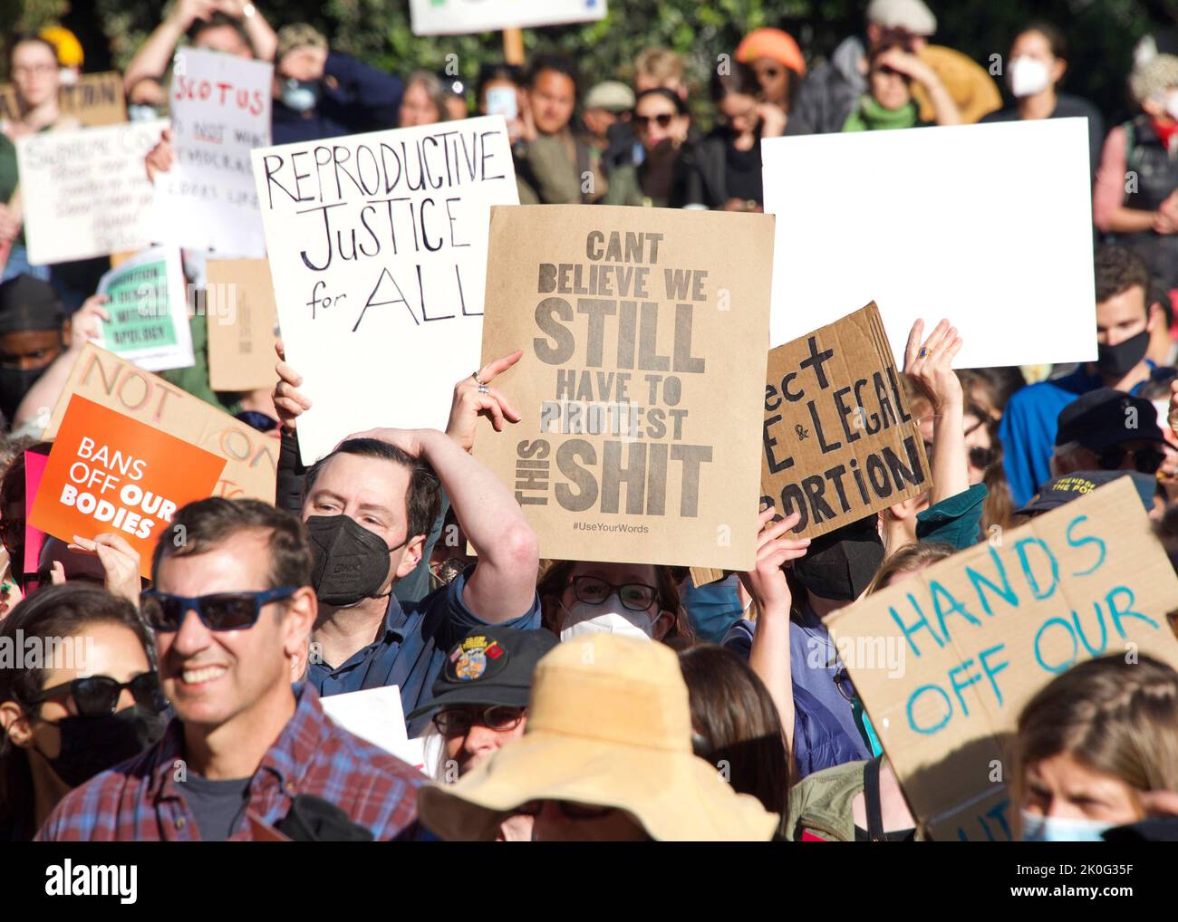 San Francisco, CA - May 3, 2022: Participants at Women’s Rights Protest after SCOTUS leak, plan to overturn Roe v Wade. Holding signs protesting the l Stock Photo