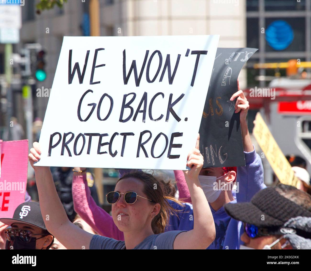 San Francisco, CA - May 7, 2022: Unidentified Participants holding signs marching in San Francisco at Women’s Rights Protest after SCOTUS leak plan to Stock Photo