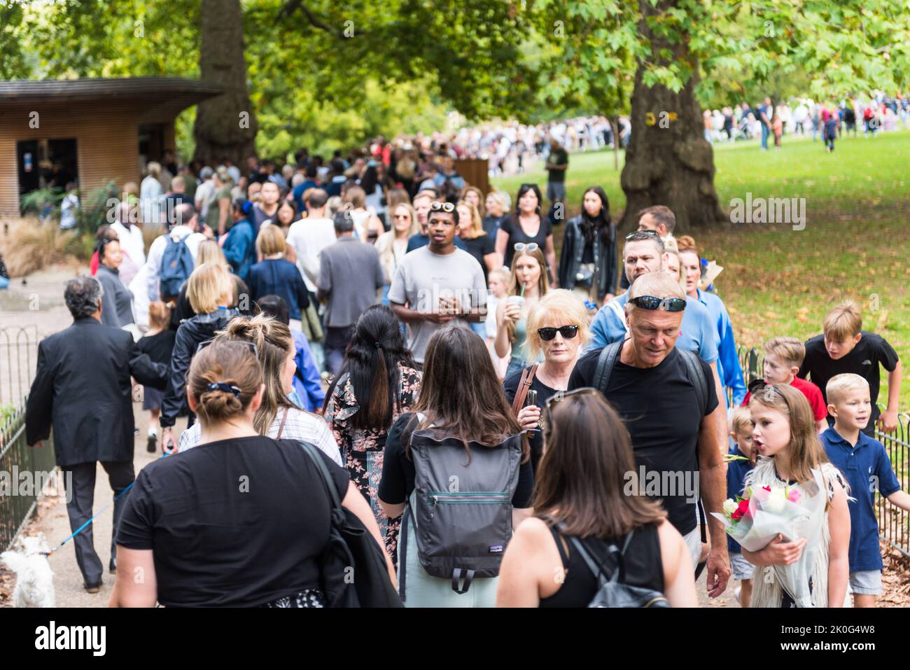Large crowds in London Buckingham Palace and nearby parks Stock Photo