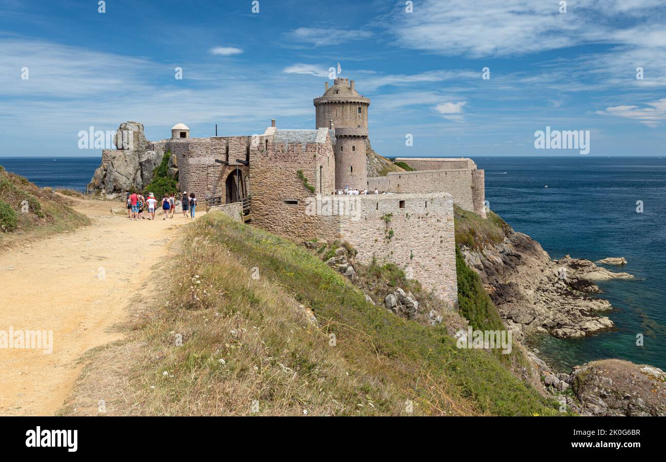 The tourist site of Fort la Latte (or the Castle of the Rock Goyon) on a rocky cape surrounded by deep blue sea. Stock Photo