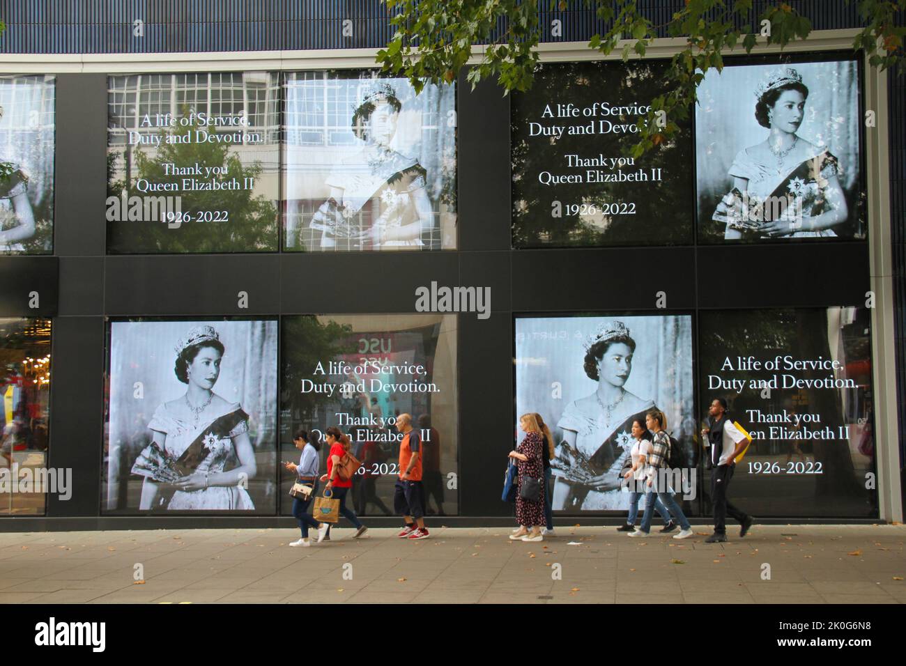London, UK. 11th Sep, 2022. Pedestrians walk past a billboard on Oxford ...