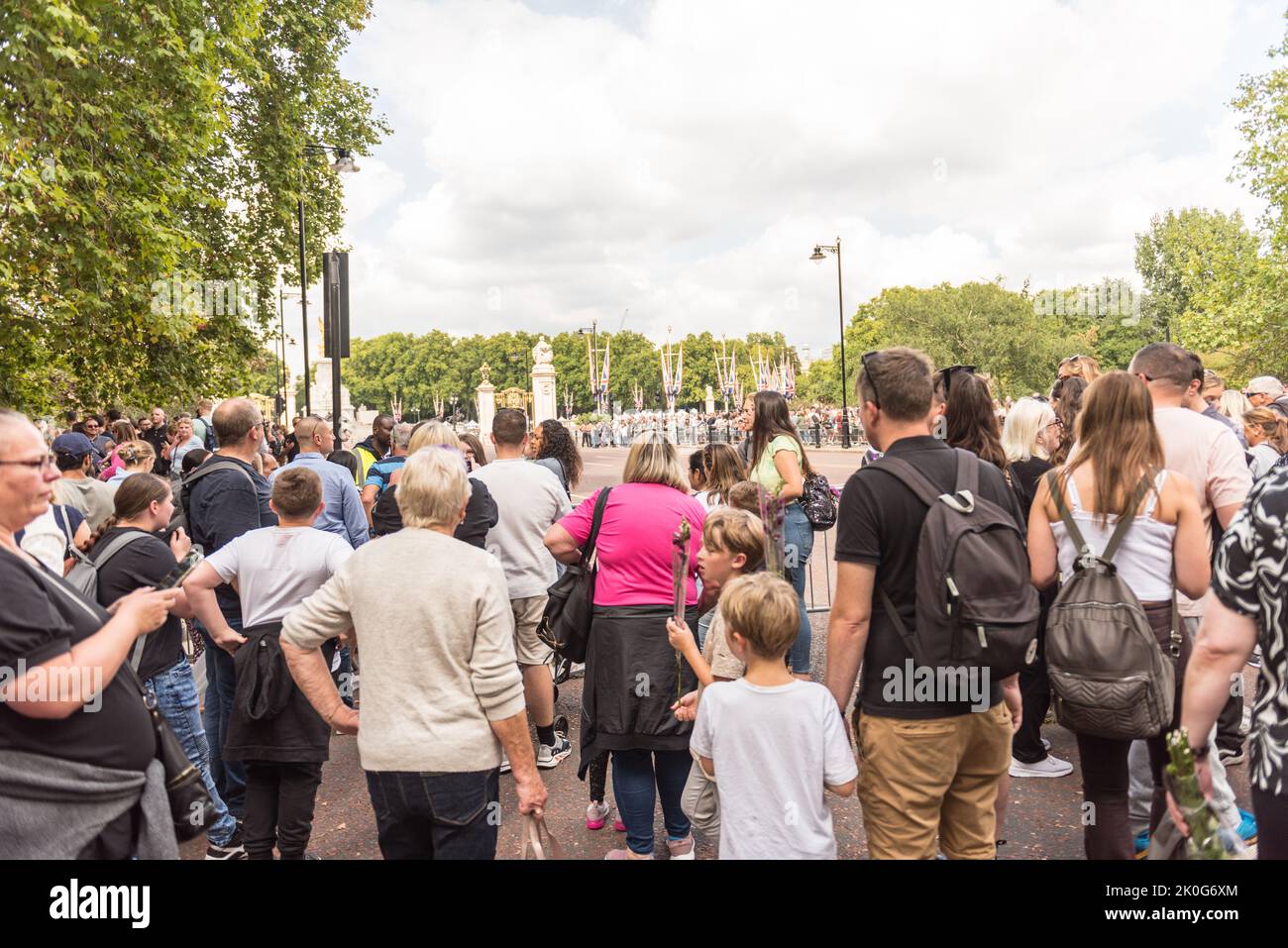 Large crowds in London Buckingham Palace and nearby parks Stock Photo