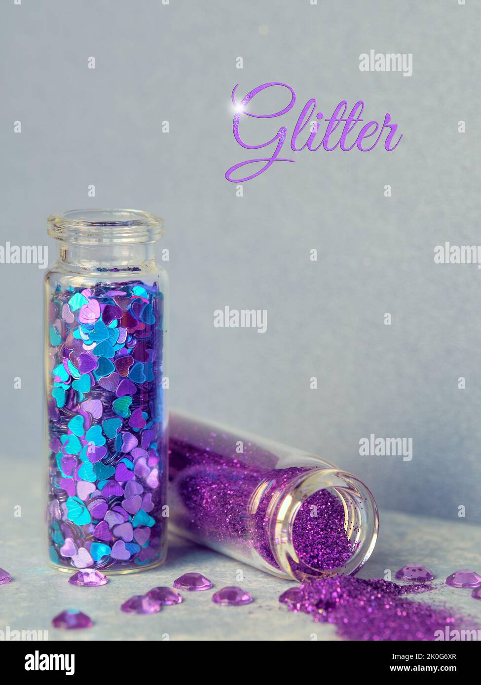 All kinds of glitter products on pink sparkling background. Closeup on