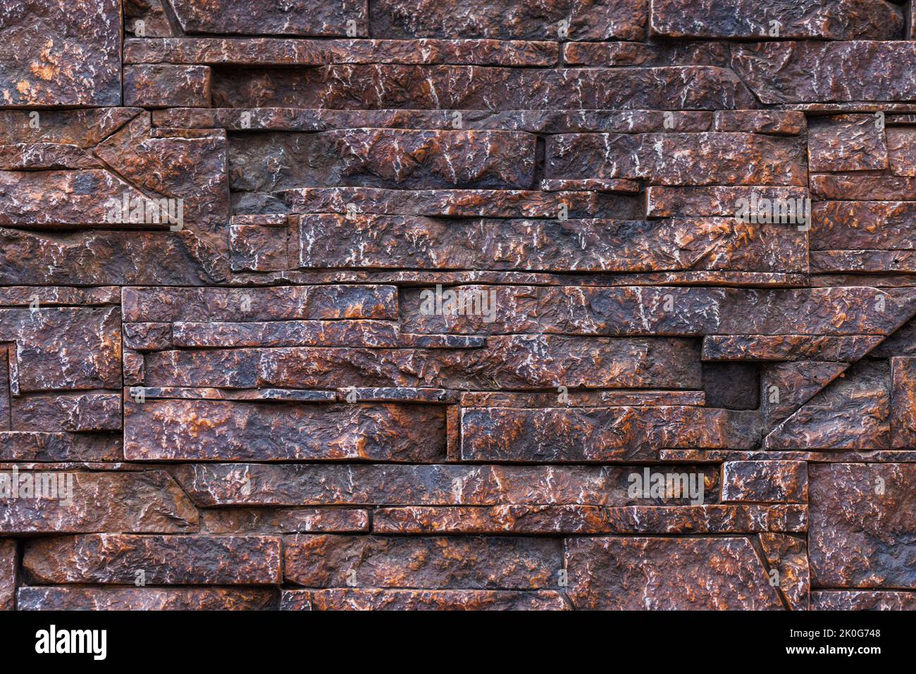 fake stone wall, plastic panel imitating natural slab wall brickwork Stock Photo