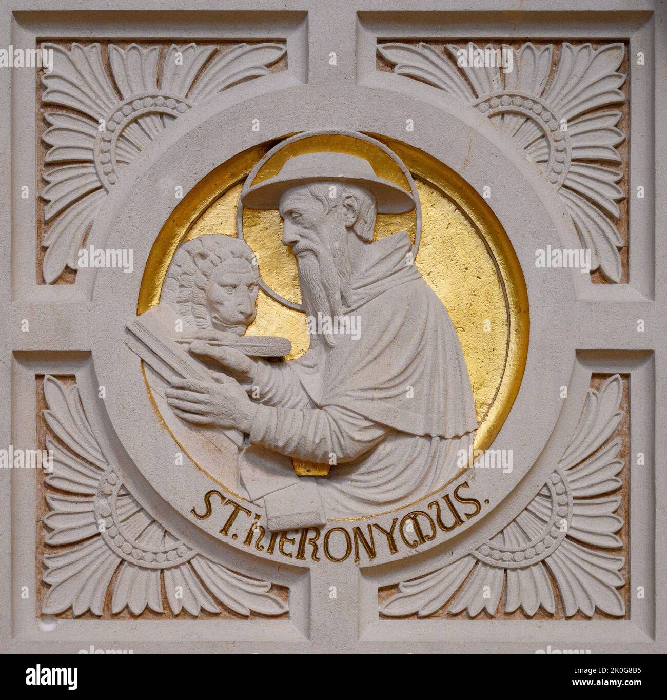 Saint Jerome. Relief on the pulpit in the Church of Saints Cosmas & Damian in Clervaux, Luxembourg. Stock Photo