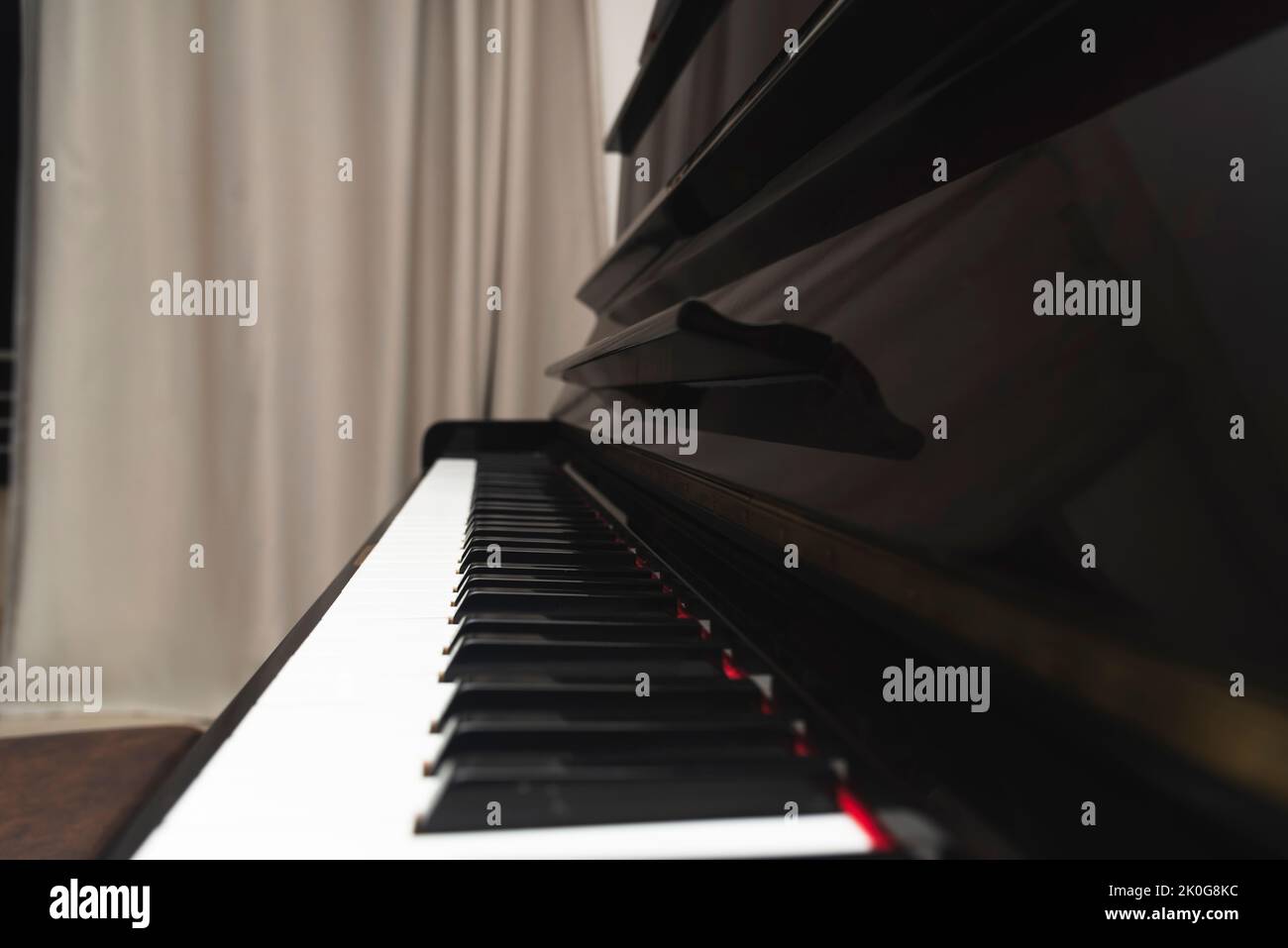 Upright piano keys. Made of dark brown wood Stock Photo Alamy