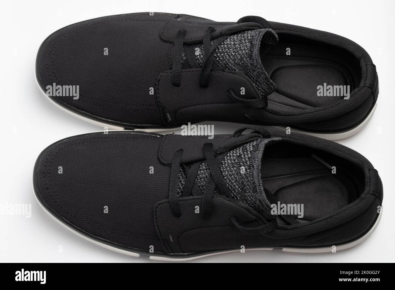 Black soft pair shoes above top view isolated on studio background Stock Photo