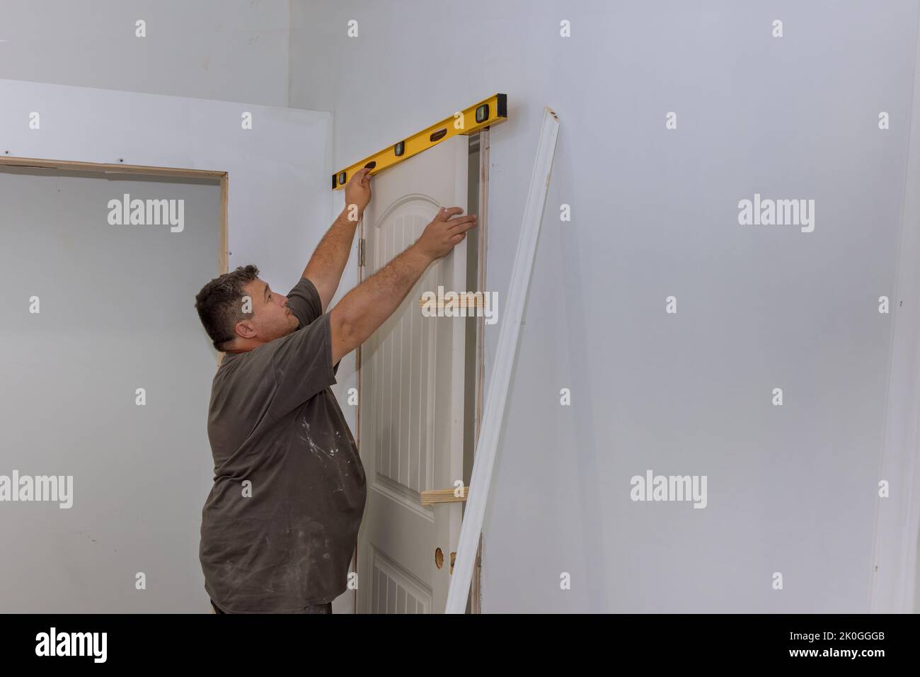 During the installation of interior doors in new house with worker