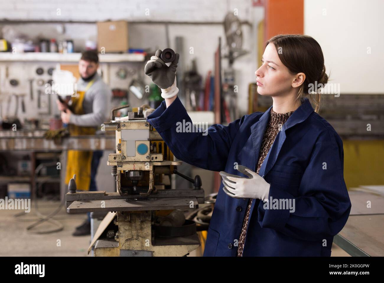 Workwoman working on milling machine Stock Photo - Alamy