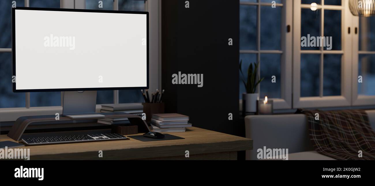 Home workstation in the living room at night with modern PC desktop