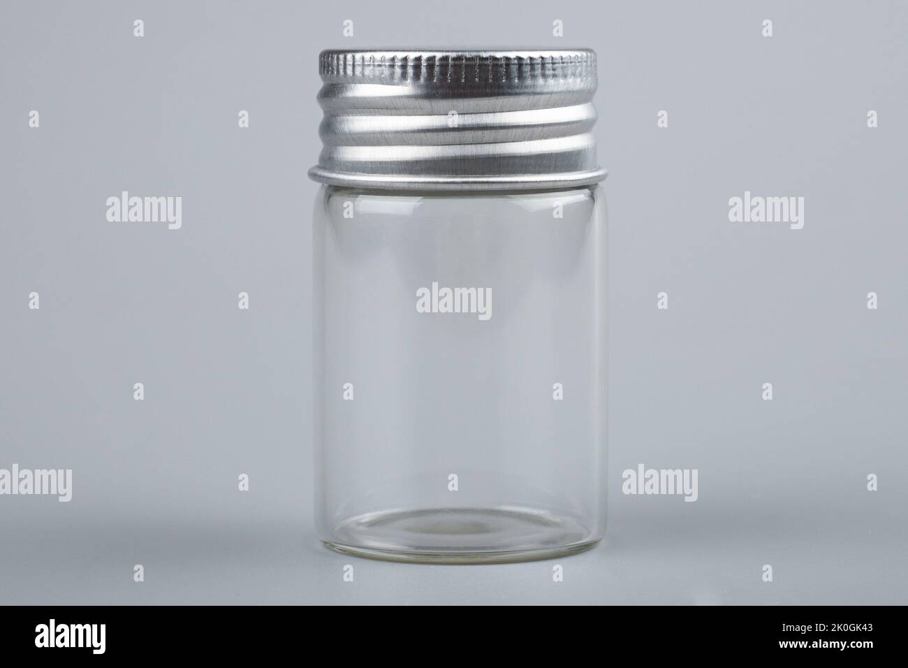 empty transparent bottle test tube on gray background Stock Photo Alamy
