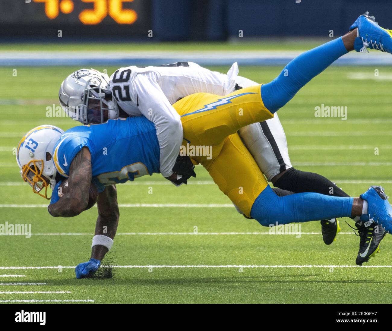 Inglewood, United States. 11th Sep, 2022. Raiders' cornerback Rock Ya-Sin (26) takes down Chargers' wide receiver Keenan Allen (13) after a short reception during the first half of a game between the Los Angeles Chargers and the Oakland Raiders at SoFi Stadium in Inglewood CA, Sunday September 11, 2022. Photo by Mike Goulding/UPI Credit: UPI/Alamy Live News Stock Photo