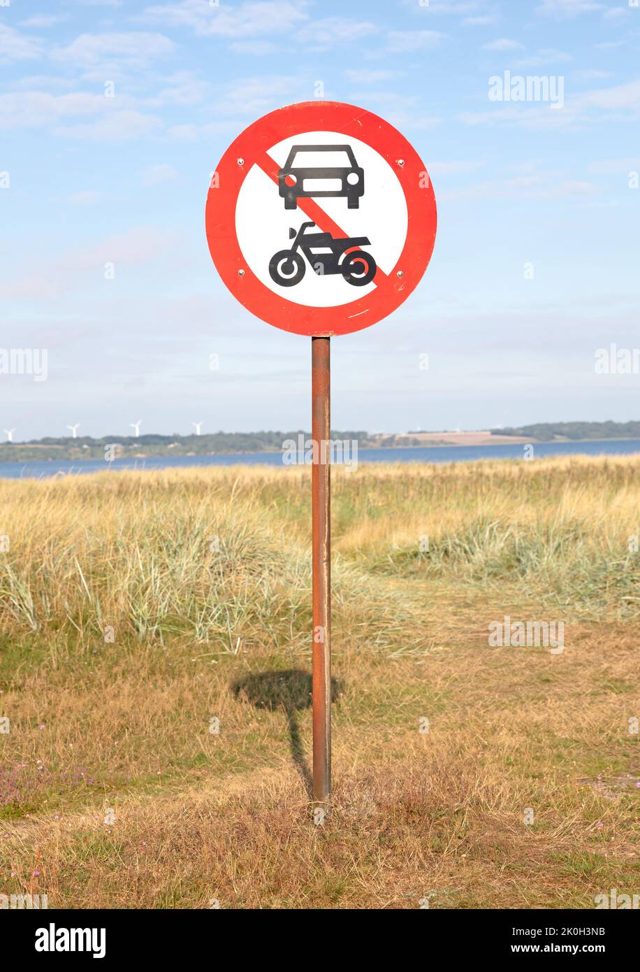 Prohibited Car and Motorcycle, round red symbol traffic sign, dunes in Denmark Stock Photo