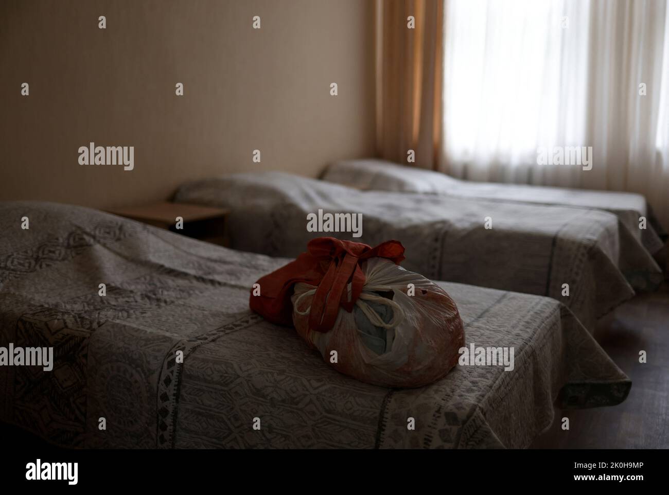 A resident's belongings are seen in a bedroom at a facility for people with special needs, amid Russia's invasion of Ukraine, in Odesa, Ukraine, June 6, 2022. Poverty is the main reason children are sent into institutions – 80 percent of families fall below the poverty line after the birth of their second child, according to a 2021 study on child protection systems by Ukraine's former Commissioner for Children’s Rights, Mykola Kuleba.     REUTERS/Edgar Su Stock Photo