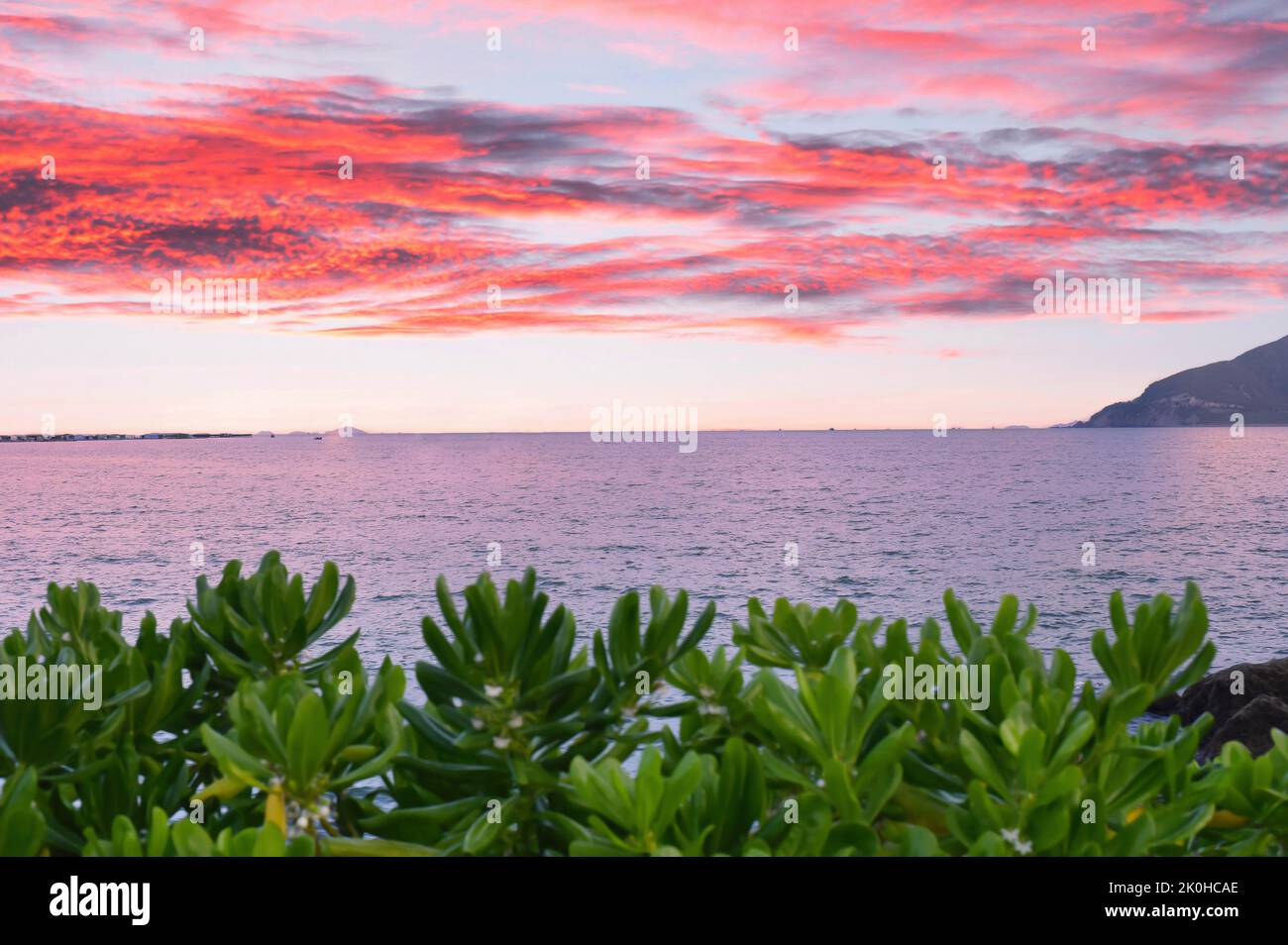 red sunset under sea and greens in Vietnam Stock Photo
