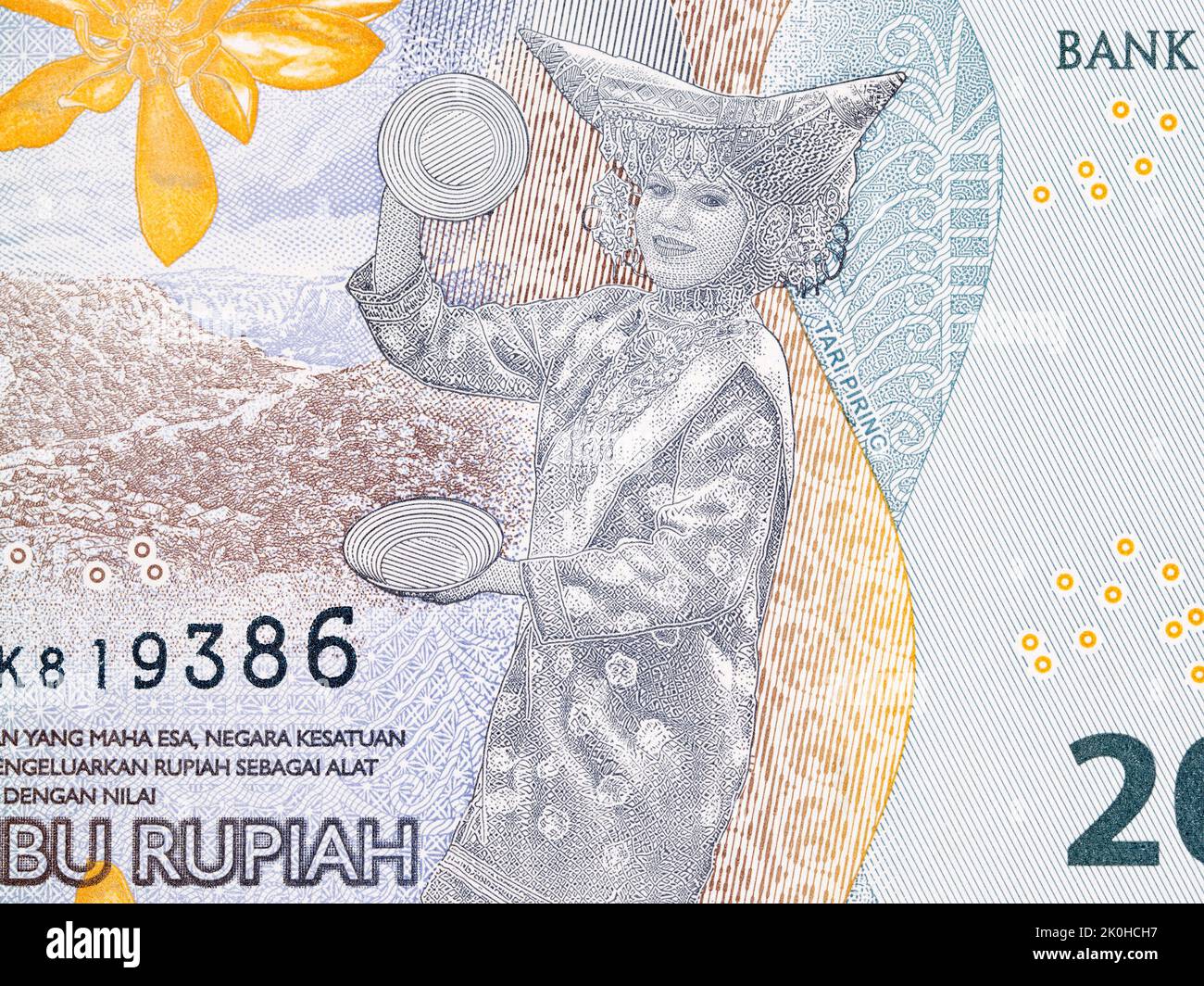 Piring dance from Indonesian money - Rupiah Stock Photo