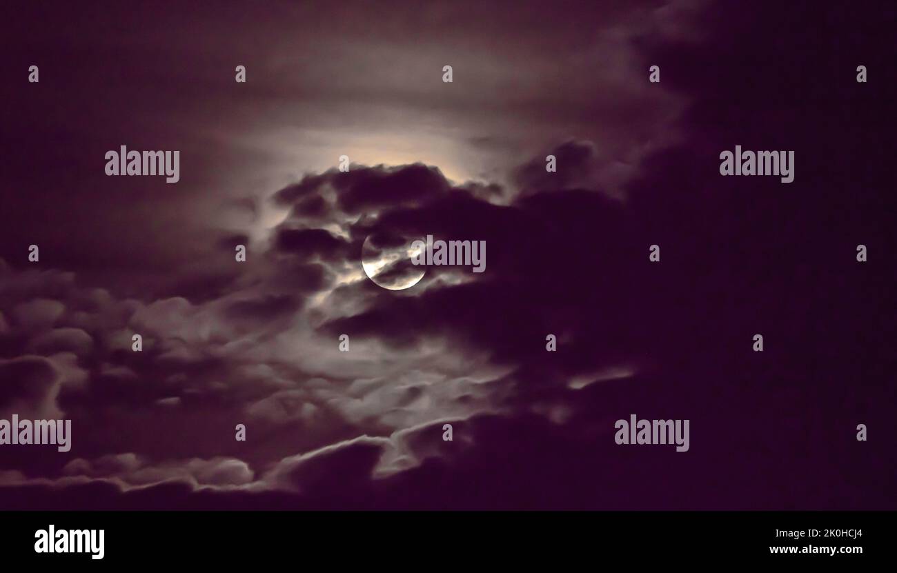 full moon in the sky with clouds landscape Stock Photo - Alamy