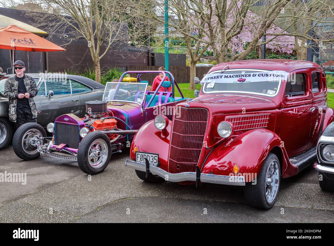 A 1935 Ford Coupe and a hot rod on display at a classic car show. Tauranga, New Zealand Stock Photo