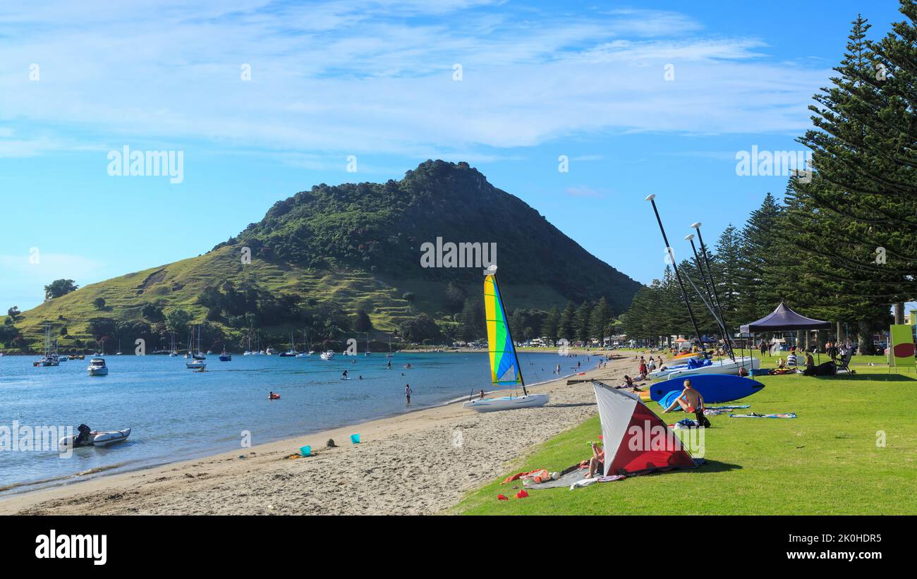 Mount Maunganui, New Zealand. The sheltered beach at Pilot Bay, being enjoyed by families on a summer day Stock Photo