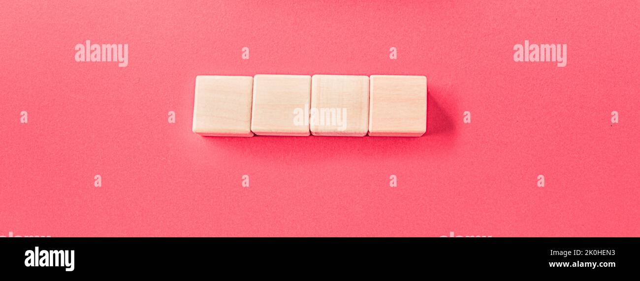 Wooden toy blocks on soft pink background Stock Photo - Alamy