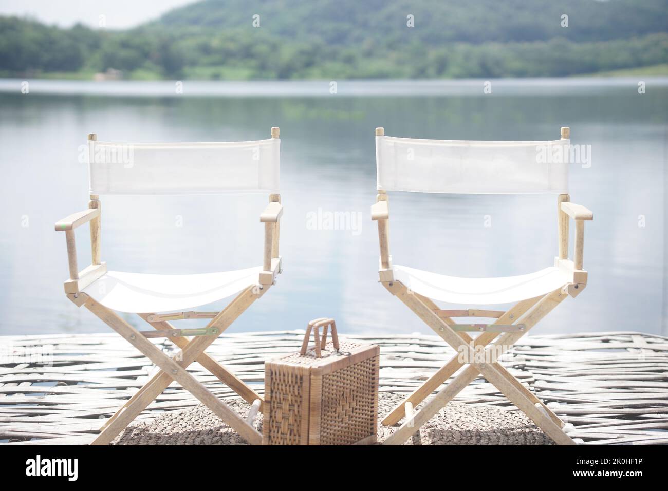 chair for relaxing on terrace balcony near pond river Stock Photo