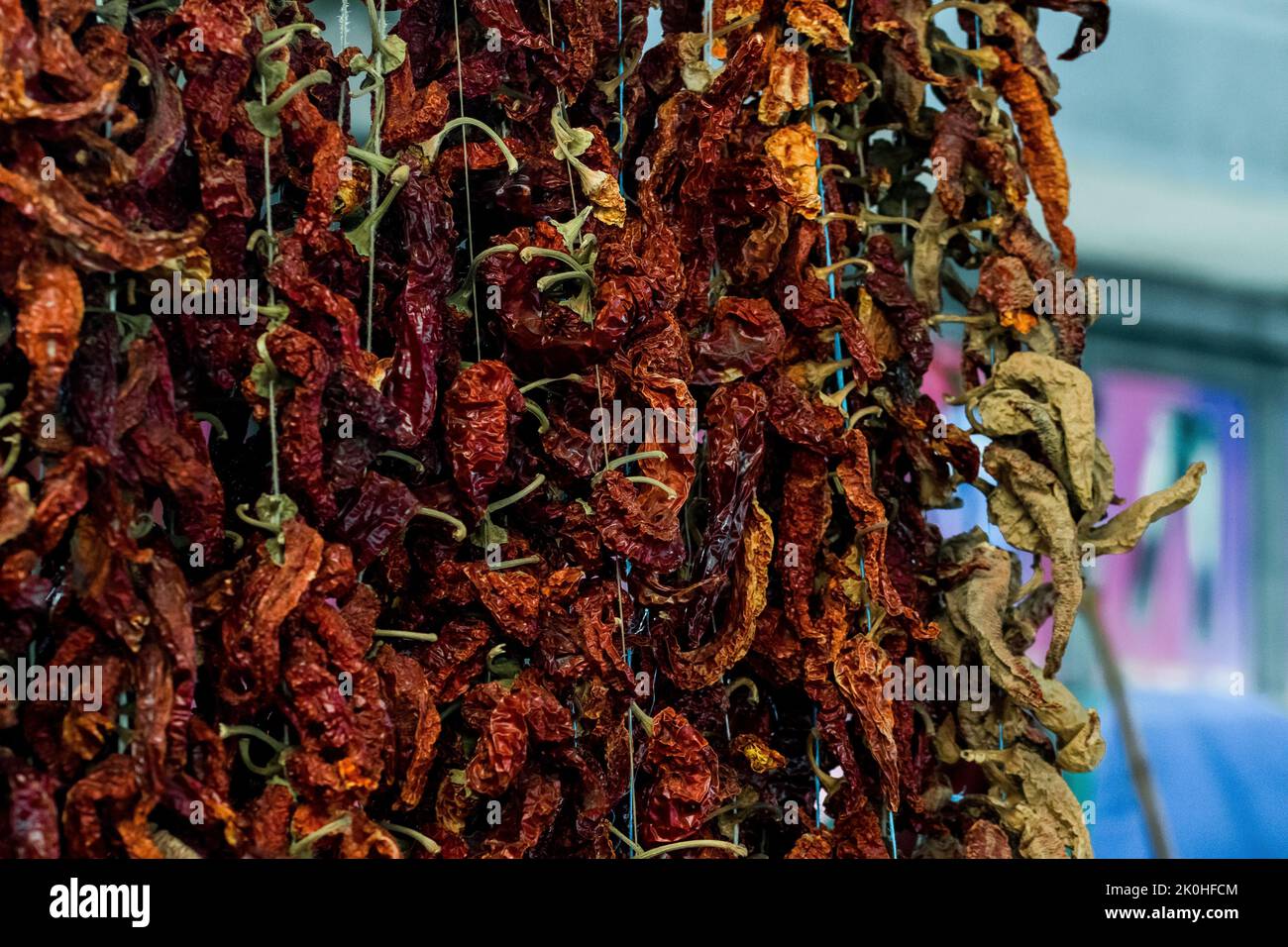A bunch of dried red chili peppers, for sale at an open green market in ...