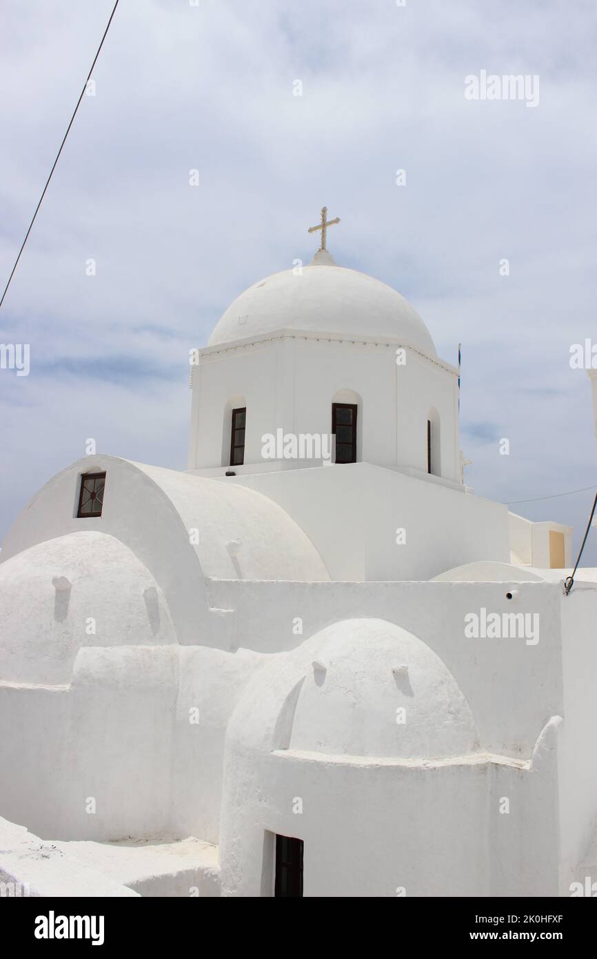 A vertical shot of Agii Anargiri Church in Megalochori village, Santorini Island Stock Photo