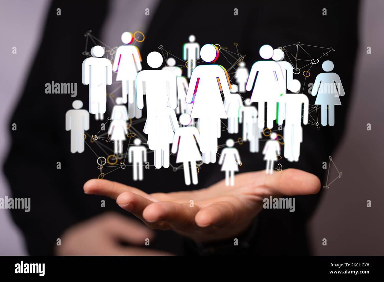 A businessman showing 3D rendered user icons floating on the palm of ...