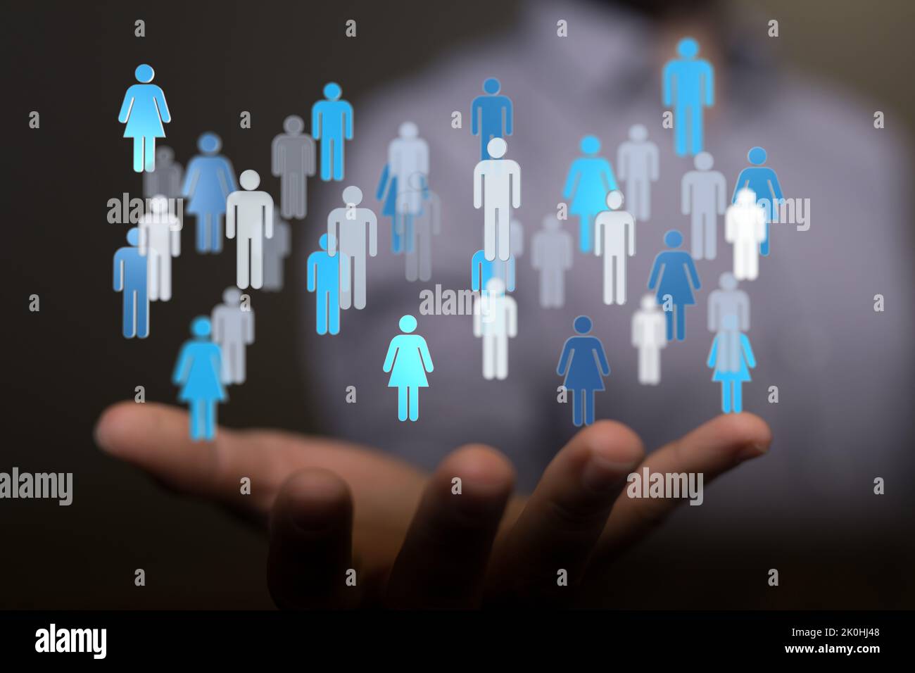 3d floating people icons over a hand a concept of networking, HR