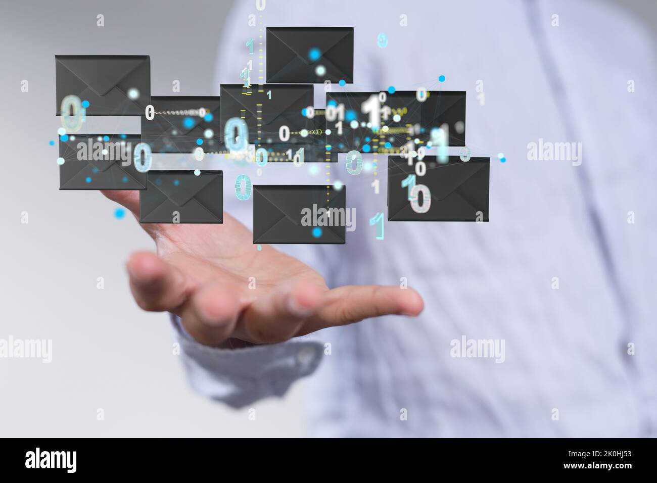 3d floating massage envelop icons  and binary code over a hand- a concept of connection, networking Stock Photo