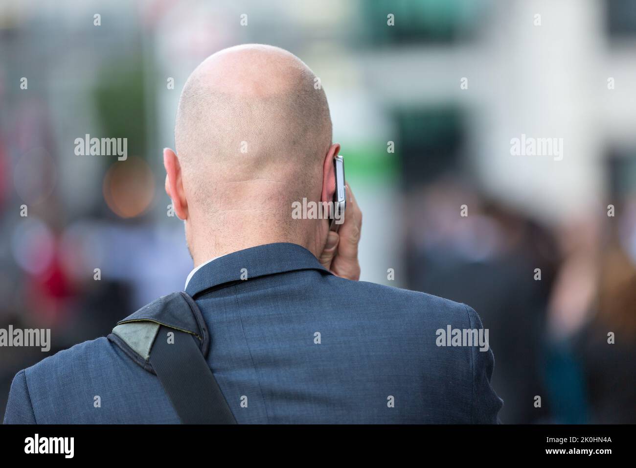 businessman with mobile phone on his ear makes a call Stock Photo