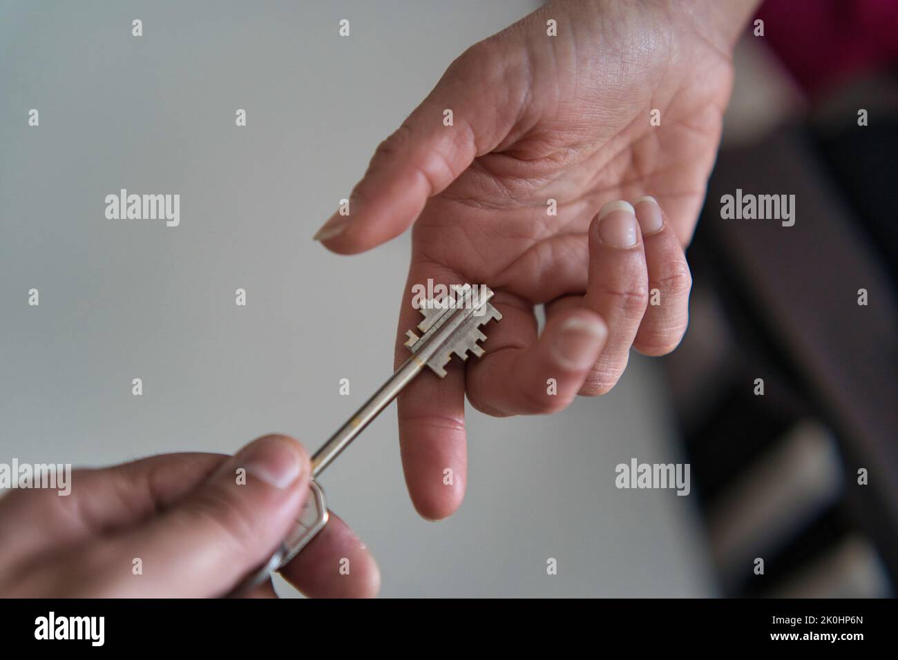 An closeup of a key exchange between two people Stock Photo Alamy