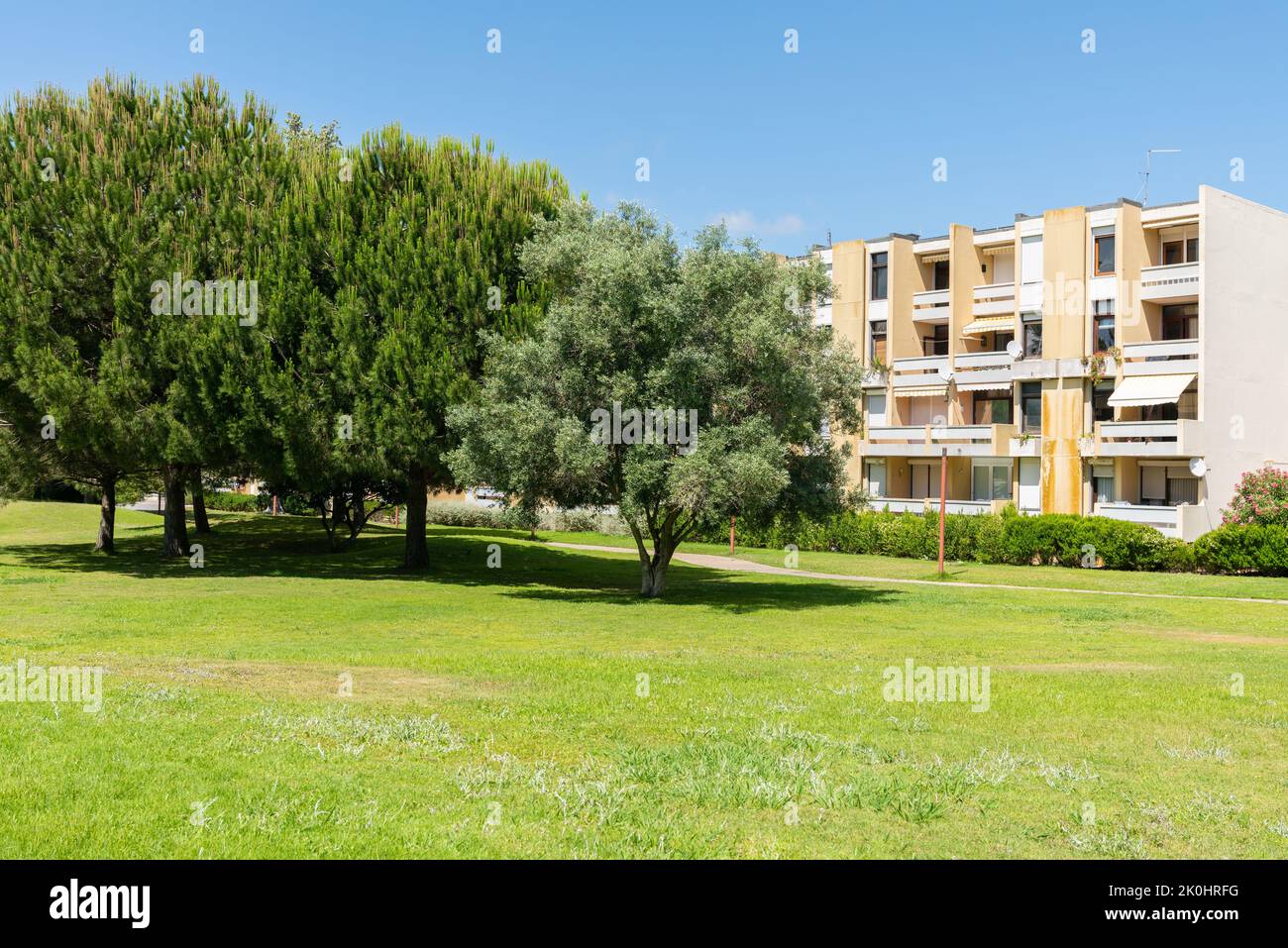 The garden of Troia covered with green trees and apartment complexes, Grandola municipality, Portugal Stock Photo