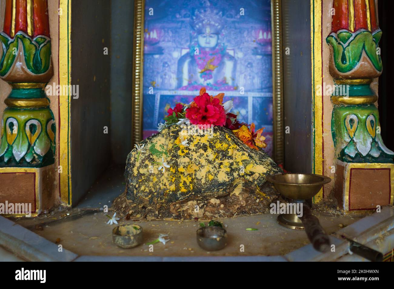 An Altar in the Jain temple in Mumbai with colorful Indian ornaments and golden pots Stock Photo