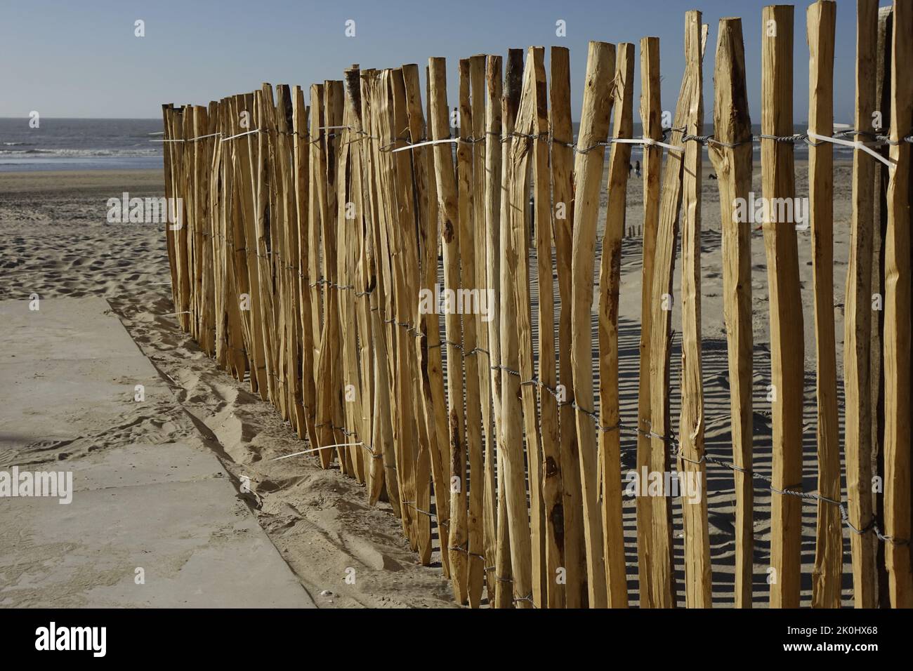 A wooden fence on the beach in North Holland, Netherlands Stock Photo ...