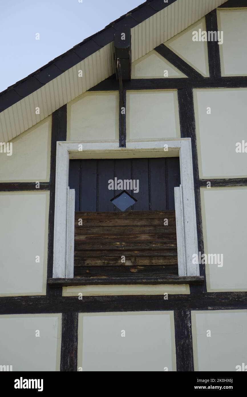 A low angle shot of an old wooden window of a house in Dahlbruch ...