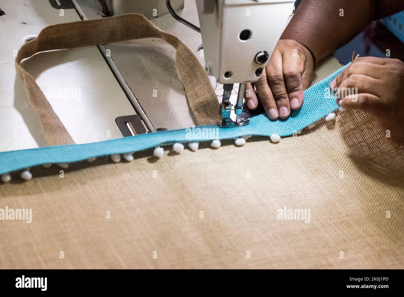 Tailors sewing fair trade handcraft Stock Photo