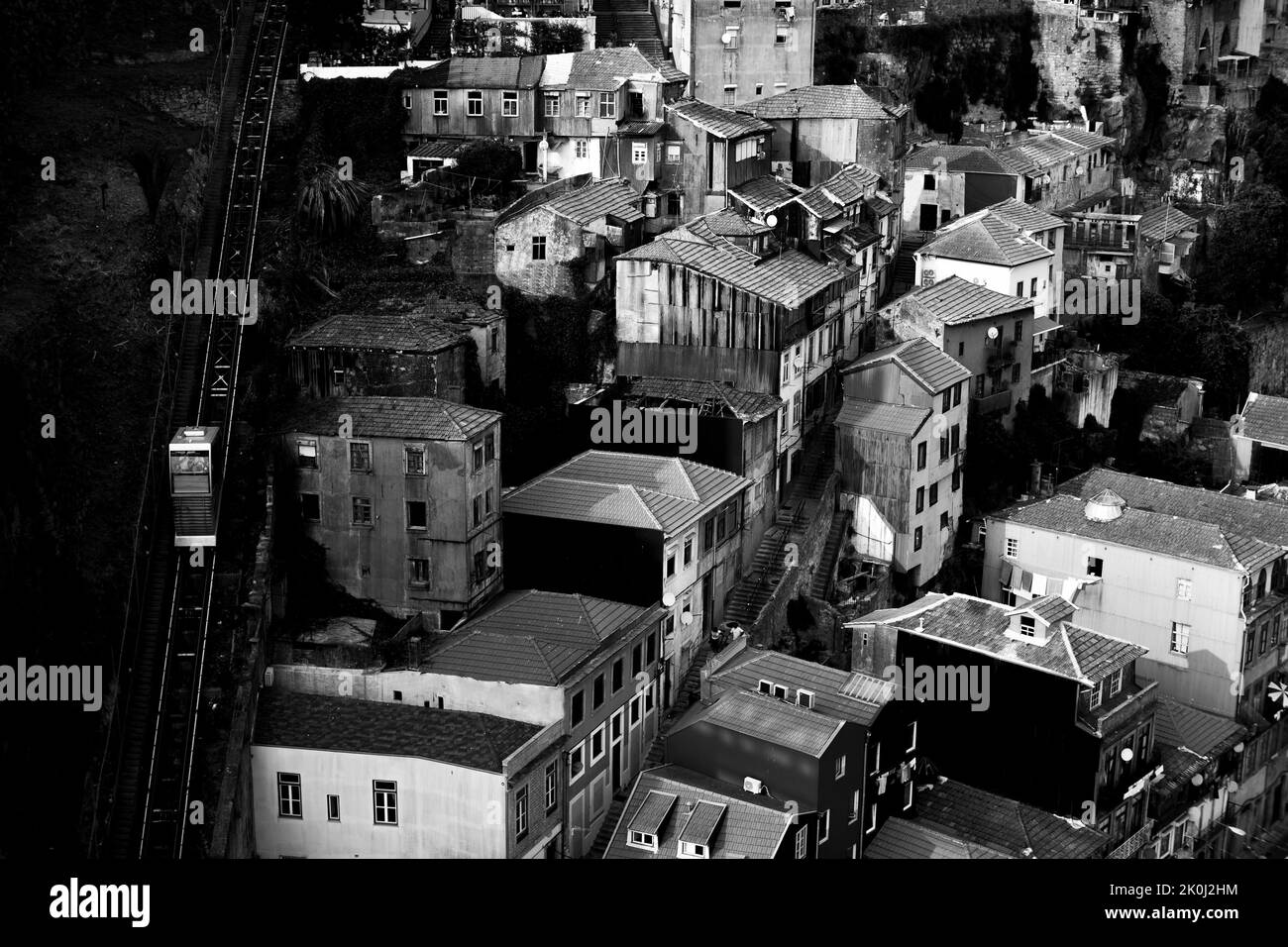 View of the old quarter of Ribeira with the cable car, Porto, Portugal. Black and white photo. Stock Photo